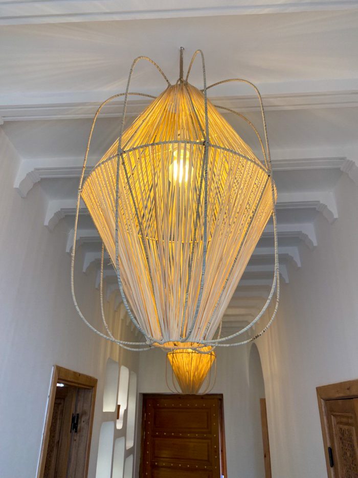 Diamond raffia pendant light with sculptural handwoven cage design