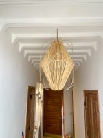 Diamond raffia pendant light with sculptural handwoven cage design
