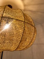 Handmade wavy raffia pendant light with ribbed pumpkin shape