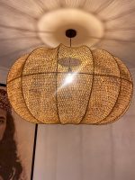 Handmade wavy raffia pendant light with ribbed pumpkin shape