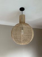 Round raffia pendant light handmade in Morocco with woven globe shape