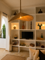 Asymmetric raffia pendant light with handmade curved canopy shade