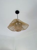 Sculptural raffia pendant light with open radial flared shade