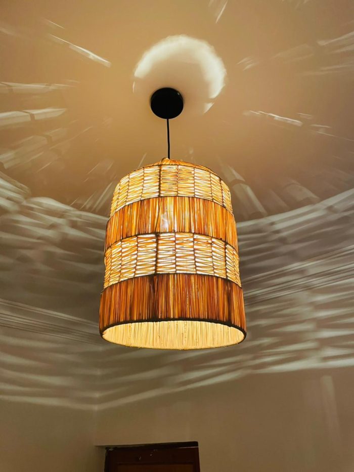 Tiered raffia pendant light with handwoven bell shaped shade