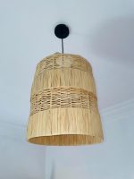 Tiered raffia pendant light with handwoven bell shaped shade