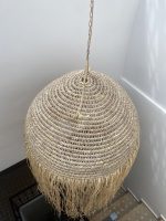Moroccan straw ball pendant light with long natural raffia fringe