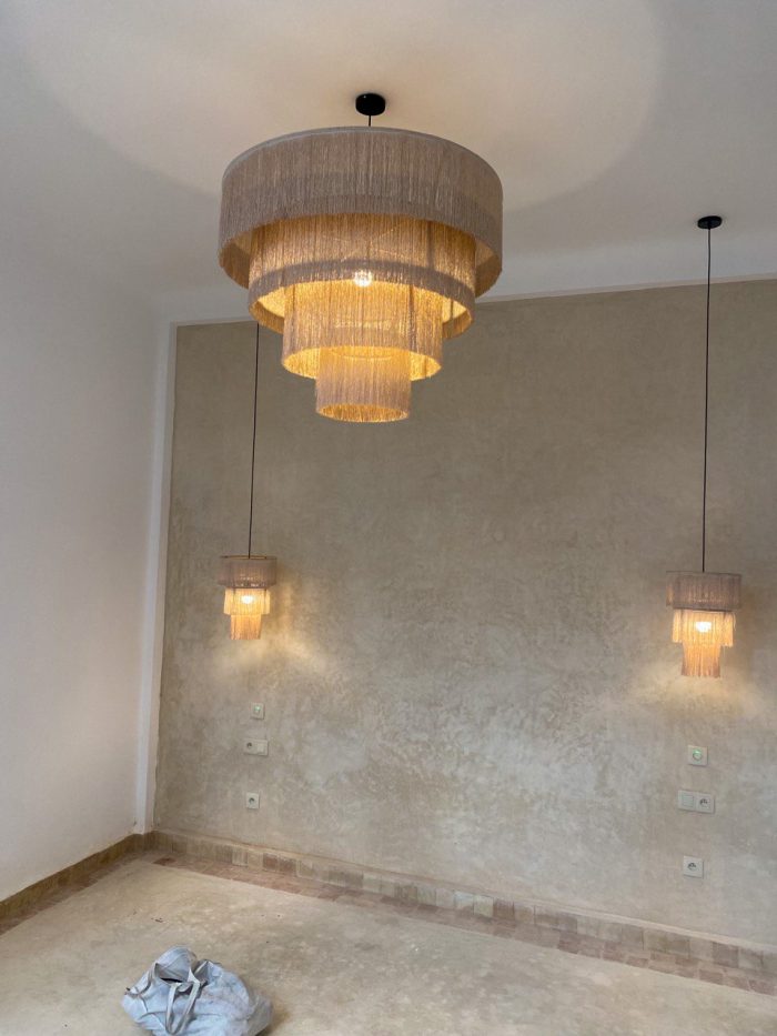 Cascading fringe chandelier with layered natural fiber drum shades