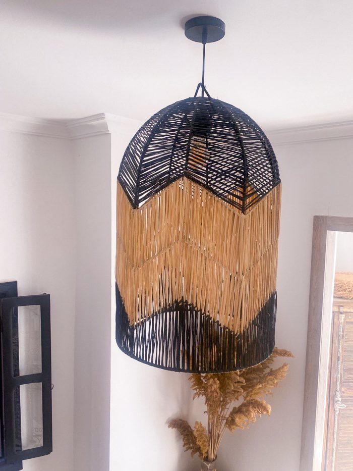 Black and natural bell raffia pendant light with geometric woven design
