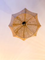 Sculptural raffia pendant light with rounded handmade Moroccan woven shade