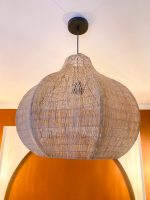 Sculptural raffia pendant light with rounded handmade Moroccan woven shade