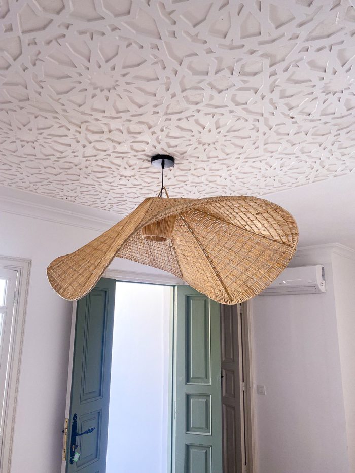 Handmade wavy raffia pendant light with sculptural woven dome shape