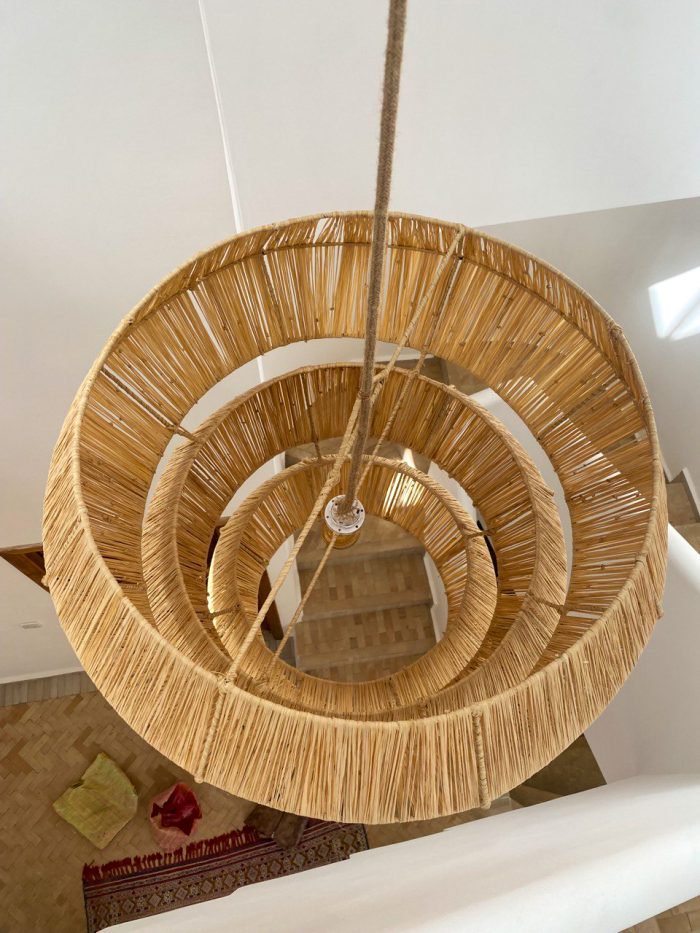 Tiered raffia pendant light with three geometric handwoven sections