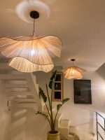 Handmade wavy flower raffia pendant light with layered natural woven petals
