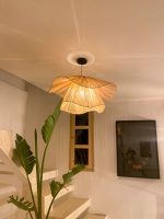 Handmade wavy flower raffia pendant light with layered natural woven petals