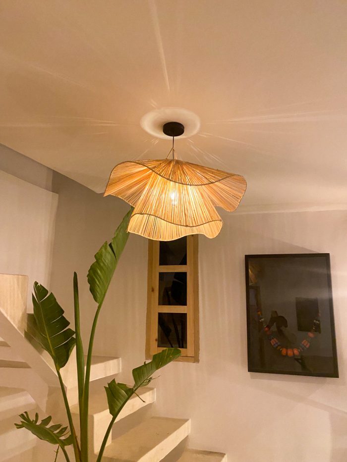 Handmade wavy flower raffia pendant light with layered natural woven petals