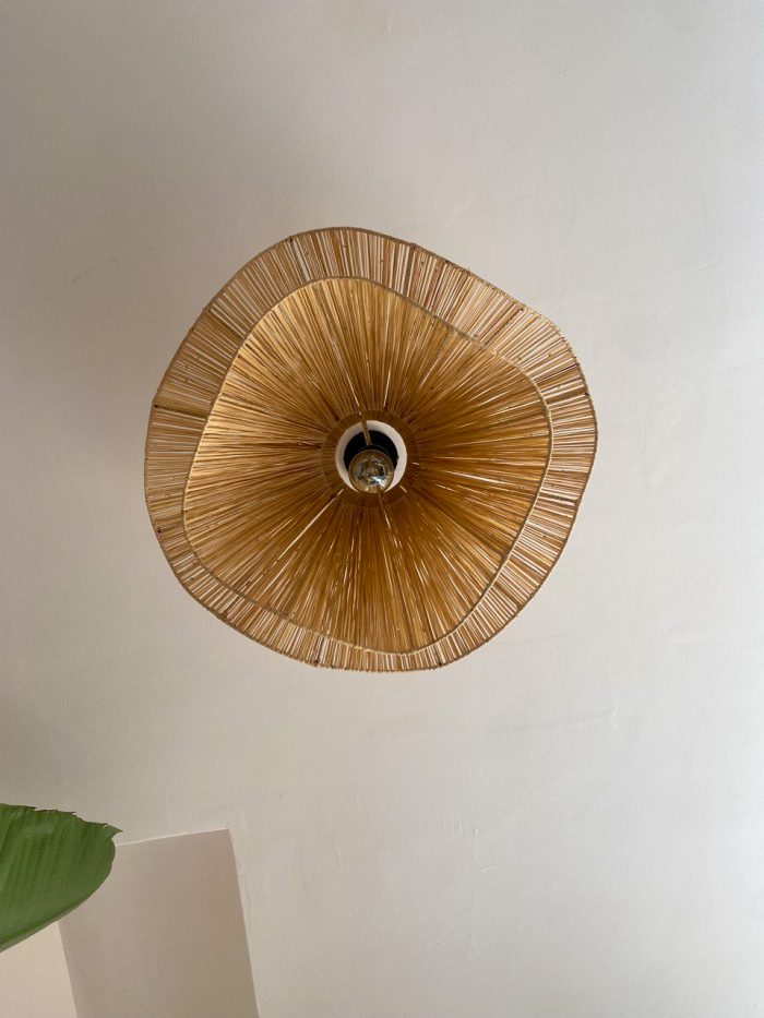 Handmade wavy flower raffia pendant light with layered natural woven petals