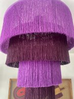 Purple fringe chandelier with cascading plum and purple tiers