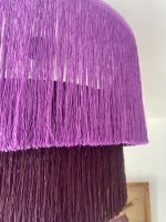 Purple fringe chandelier with cascading plum and purple tiers