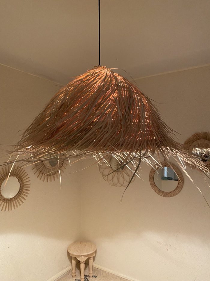 Natural Doum Straw Fringe Pendant Light handmade from woven straw and doum fibers with long flowing fringe.