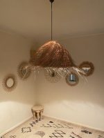 Natural Doum Straw Fringe Pendant Light handmade from woven straw and doum fibers with long flowing fringe.