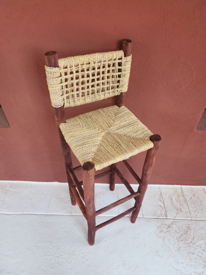 Palm Leaf Counter Stool handcrafted from solid wood with a natural handwoven palm leaf seat