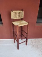 Palm Leaf Counter Stool handcrafted from solid wood with a natural handwoven palm leaf seat