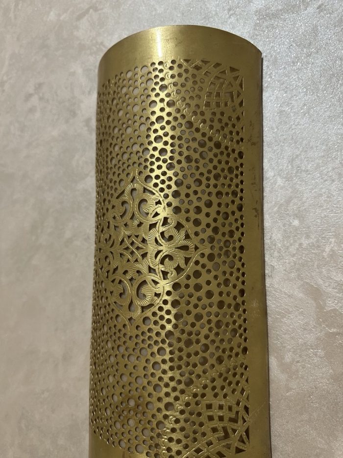 Handmade diamond medallion brass wall sconce with intricate perforated pattern and warm decorative up-and-down lighting.