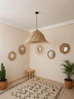 Natural Doum Straw Fringe Pendant Light handmade from woven straw and doum fibers with long flowing fringe.