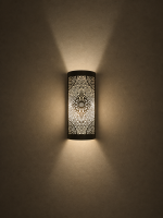 Handmade diamond medallion brass wall sconce with intricate perforated pattern and warm decorative up-and-down lighting.