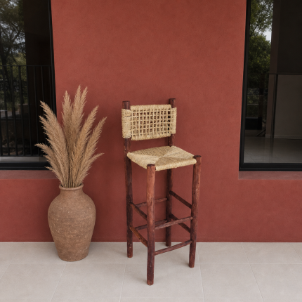 Palm Leaf Counter Stool handcrafted from solid wood with a natural handwoven palm leaf seat
