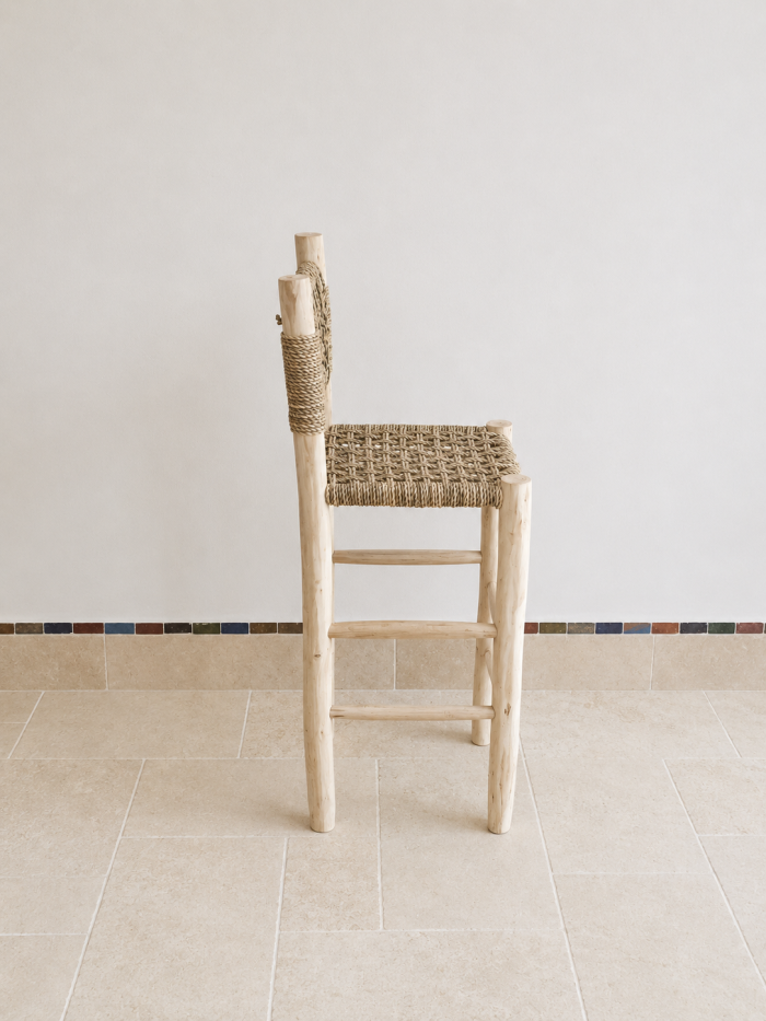 Handcrafted Palm Leaf Bar Stool made from solid wood with a natural handwoven palm leaf seat
