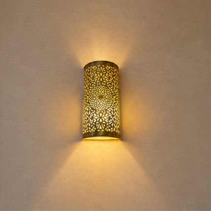 Handmade Moroccan brass wall sconce crafted from solid brass with intricate pierced detailing and warm up-and-down decorative illumination.
