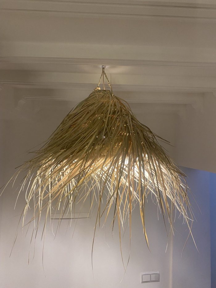 Natural Doum Straw Fringe Pendant Light handmade from woven straw and doum fibers with long flowing fringe.