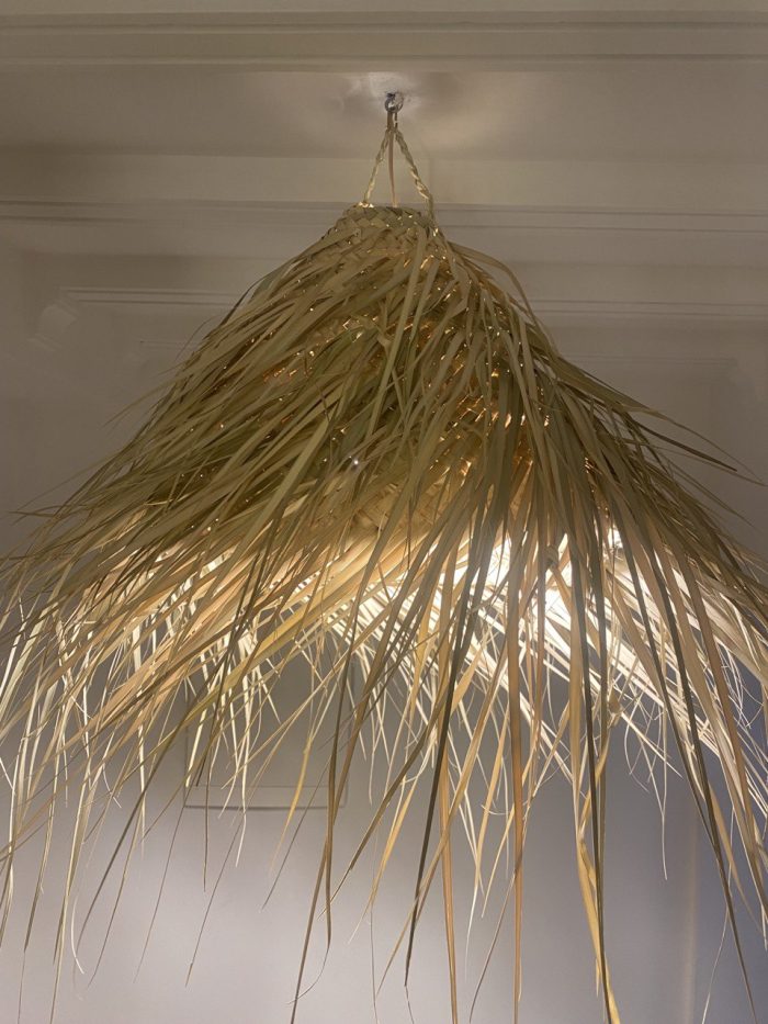 Natural Doum Straw Fringe Pendant Light handmade from woven straw and doum fibers with long flowing fringe.