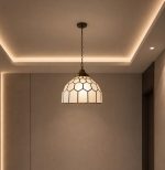 Stained glass pendant light with geometric dome shade
