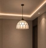 Stained glass pendant light with geometric dome shade