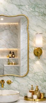 Handmade Curved Edge Brass Mirror with sculpted frame in tiled bathroom