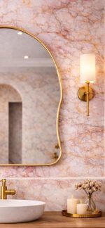 Handmade organic curved brass vanity mirror with freeform solid brass frame in bathroom interior.