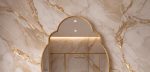 Quatrefoil Brass Mirror with sculpted frame above bathroom vanity