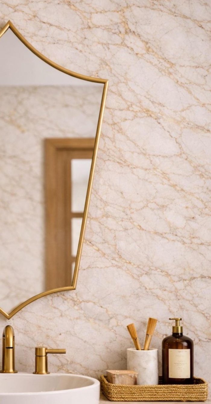 Pointed Moroccan Brass Mirror above bathroom vanity with green tile wall