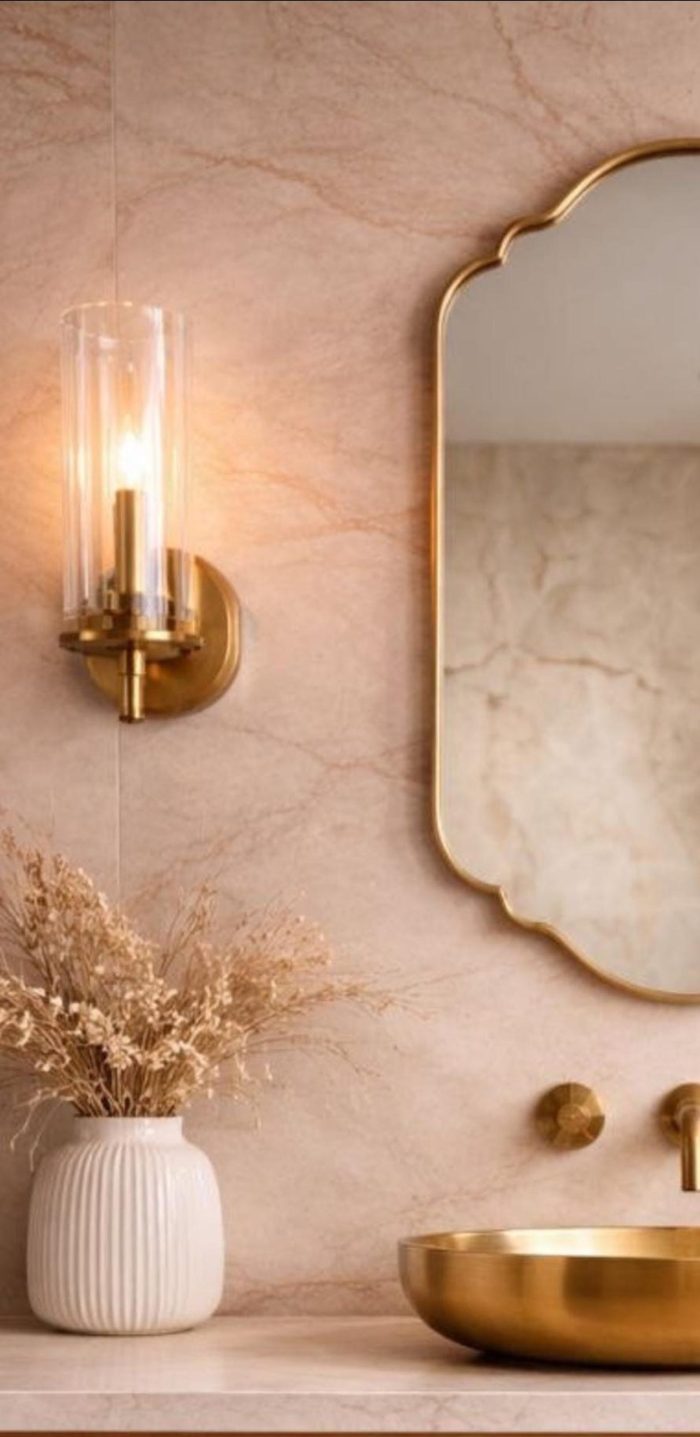 Scalloped Arch Brass Mirror above brass vessel sink and green tiled bathroom wall