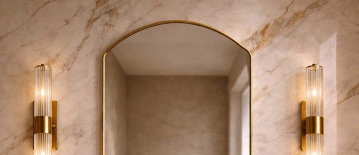 Rounded Arch Brass Mirror above bathroom vanity with handmade brass frame