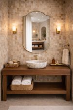 Handmade curved crown brass wall mirror with softly arched top and solid brass frame above bathroom vanity.
