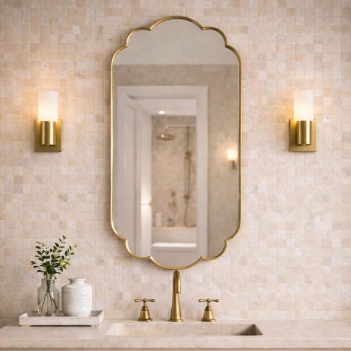 Handmade Moroccan Scalloped Brass Mirror with decorative floral shape above bathroom vanity