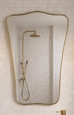 Curved Rectangle Brass Mirror with handcrafted slim brass frame in a modern bathroom vanity setting