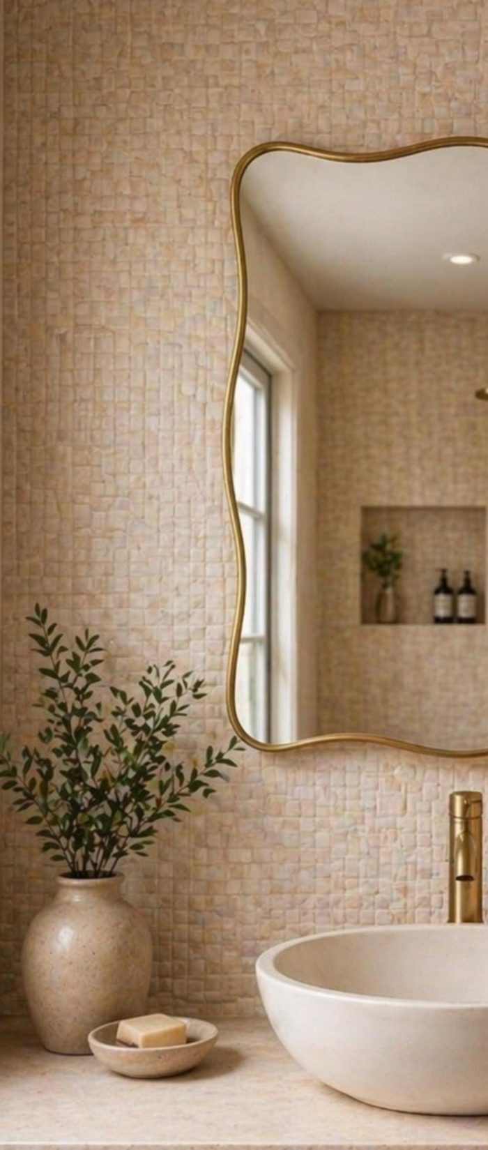 Handmade Wavy Brass Bathroom Mirror with curved edges in Moroccan bathroom interior
