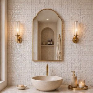Handmade Arched Brass Vanity Mirror styled with brass sconces and bathroom vanity