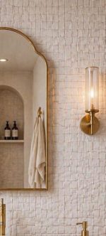 Handmade Arched Brass Vanity Mirror styled with brass sconces and bathroom vanity