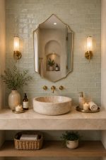 Handmade Moroccan pointed arch brass mirror with slim gold frame above a bathroom vanity.