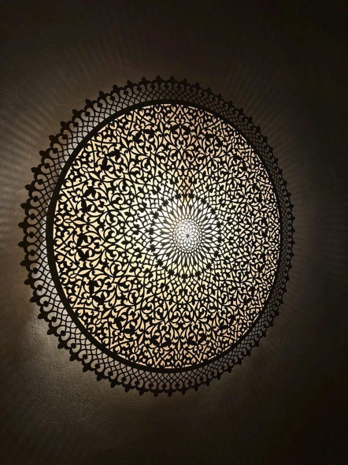 Round Filigree Brass Wall Light with intricate hand-perforated brass design